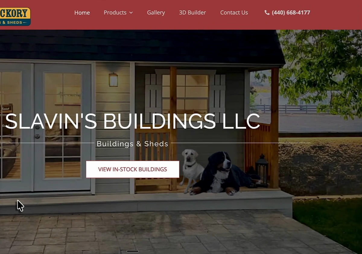 Slavin's Buildings homepage on an Old Hickory Buildings and Sheds dealer template: red header with Home, Products, Gallery, 3D Builder and Contact Us, a photo of a cabin porch with two dogs, the heading Slavin's Buildings LLC, the subheading Buildings and Sheds, and a View In-Stock Buildings button